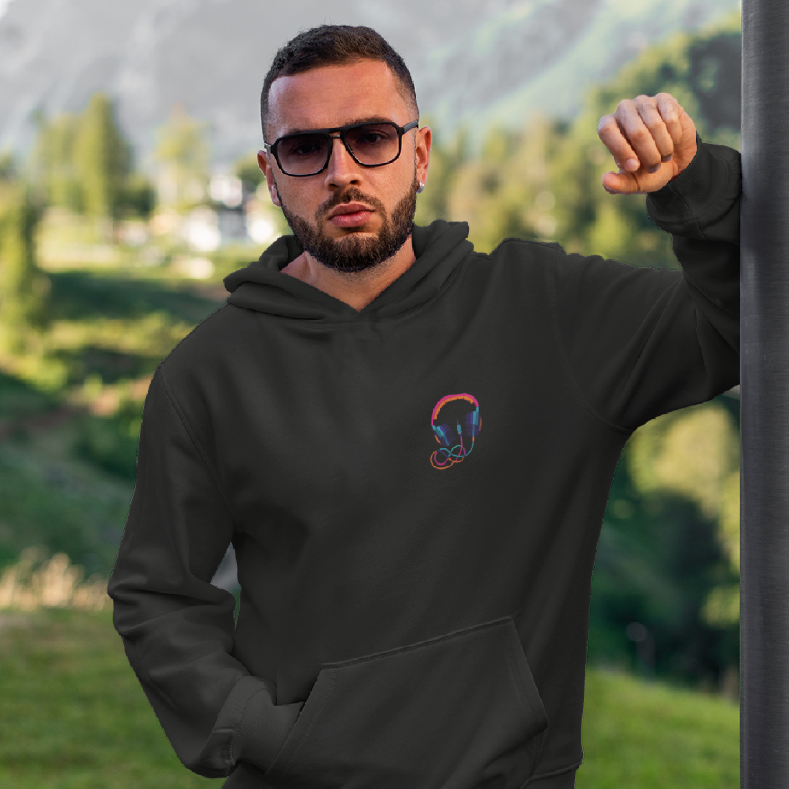 Buy this men's black oversized hoodie with headphone graphic print, cuffed sleeves, and a hood for a stylish look.
