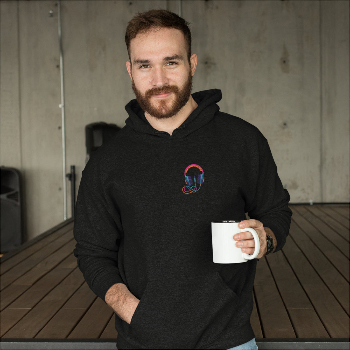 Purchase this trendy men's black oversized hoodie featuring headphone graphic, hood, and cuffed sleeves for ultimate comfort.