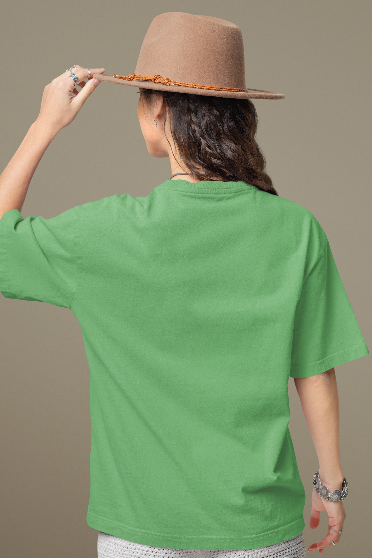 Buy Plain Sea Green oversized T-shirt with drop shoulders and graphic print, crafted from 100% cotton for breathable, everyday style.
