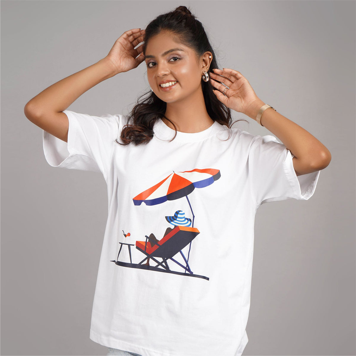 Buy White oversized T-shirt with 'Sun Beach' graphic for women. Round neck, drop shoulder design, and cotton fabric. Shop online.