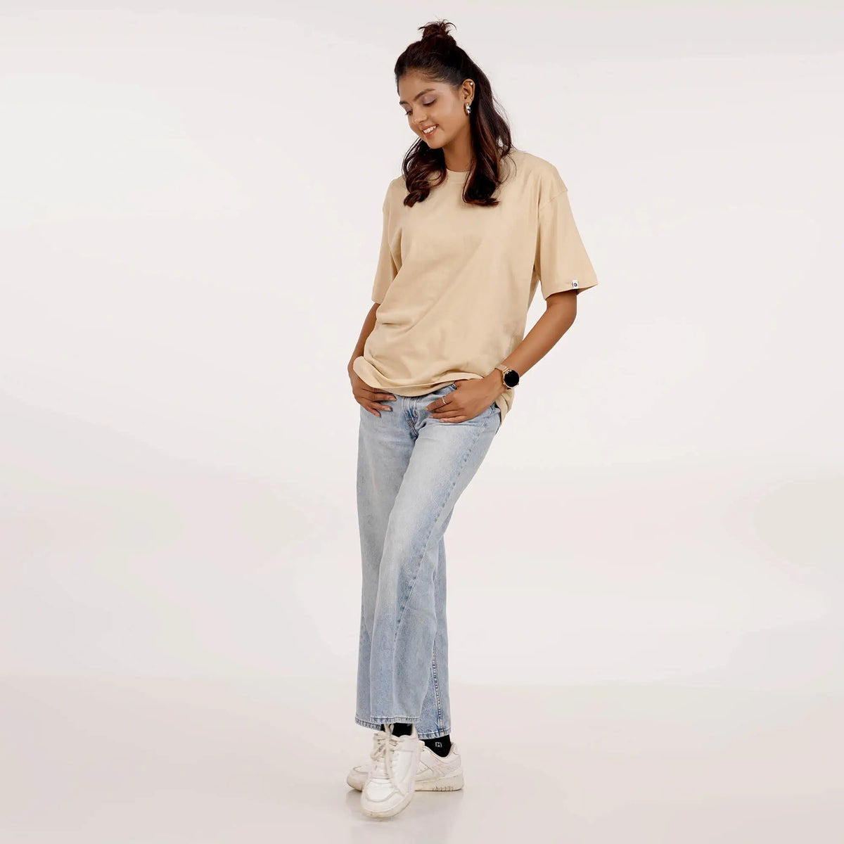 Buy a soft beige oversized T-shirt for women with drop shoulder sleeves and a round collar, crafted from pure cotton.