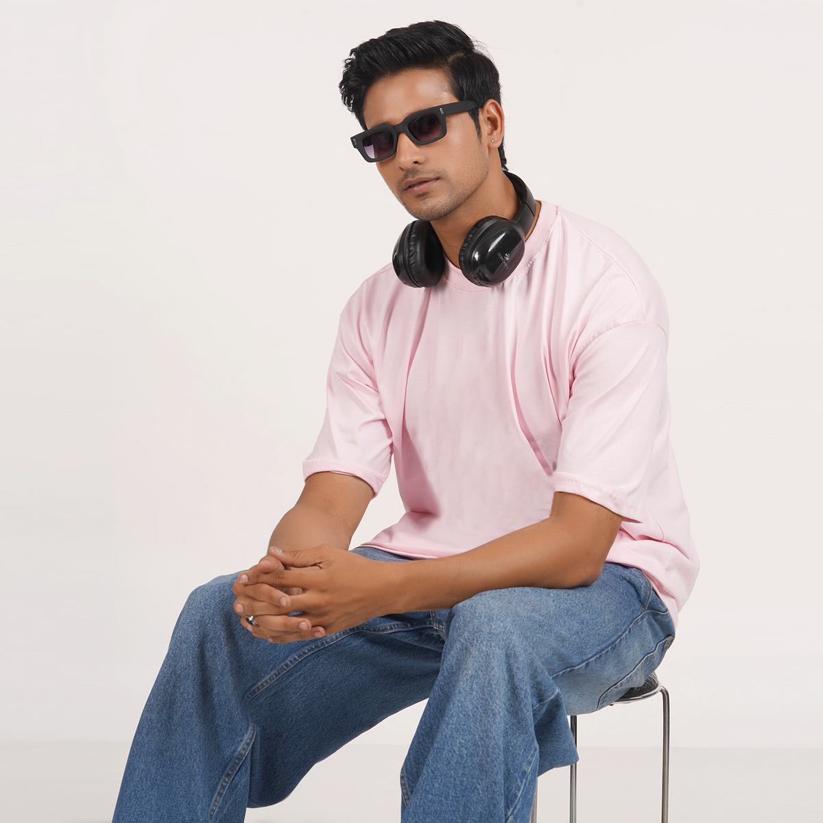 Buy men's pink oversized T-shirt with drop shoulder, graphic print, and 100% cotton for a stylish and comfy look.
