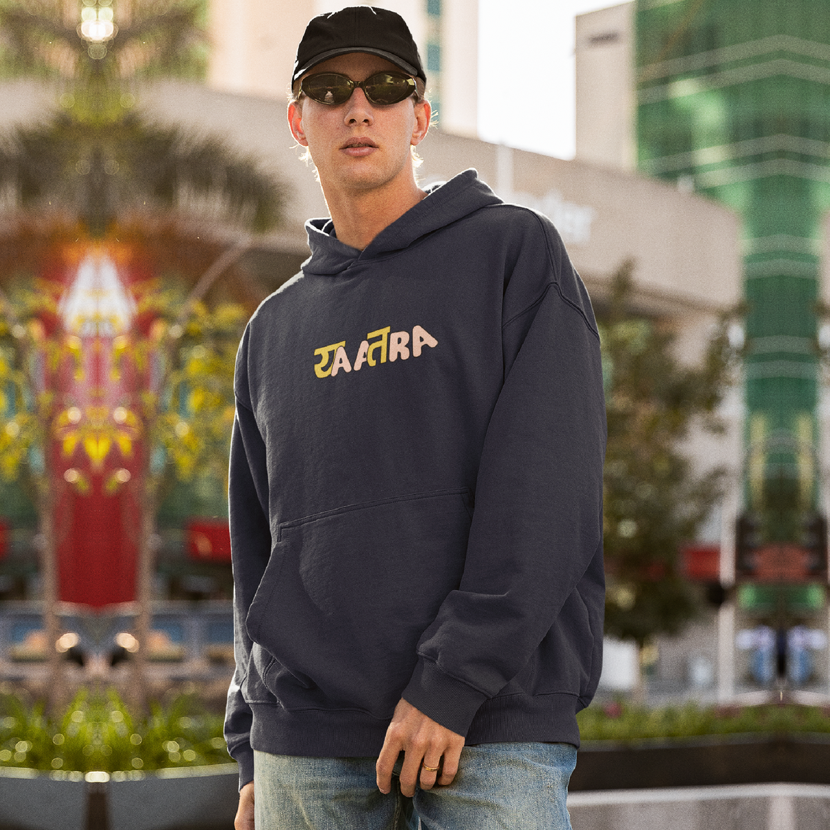 Dark blue oversized hoodie for men by Yatra, offering a relaxed fit and premium comfort. Available for Rs. 1,649, originally priced at Rs. 3,499, with a 53% discount.
