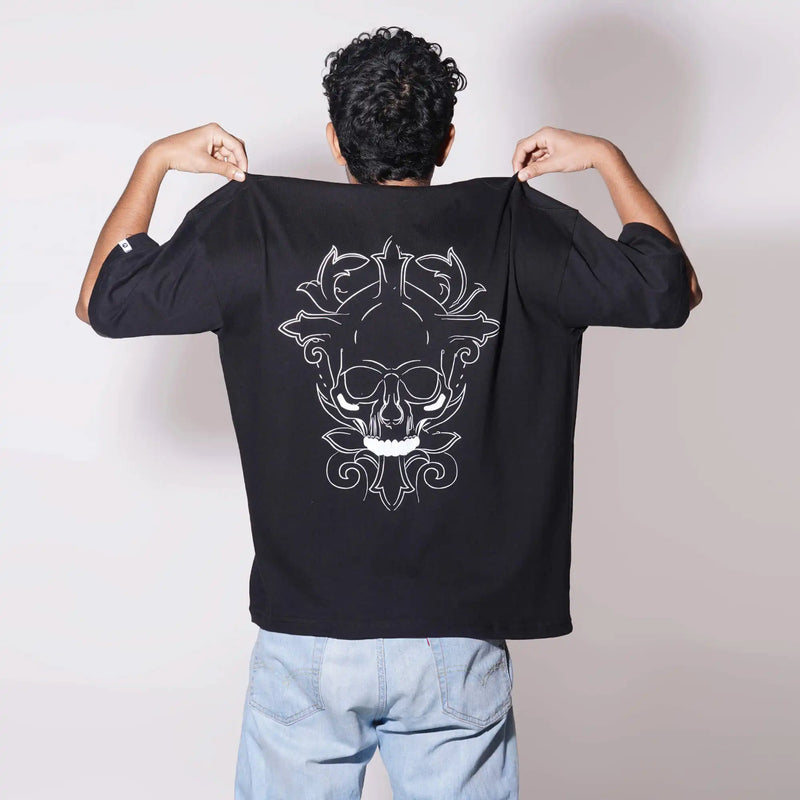 Reflective Skull : Buy online black oversized T-shirt with a reflective skull print, drop shoulders, round collar, 100% cotton.