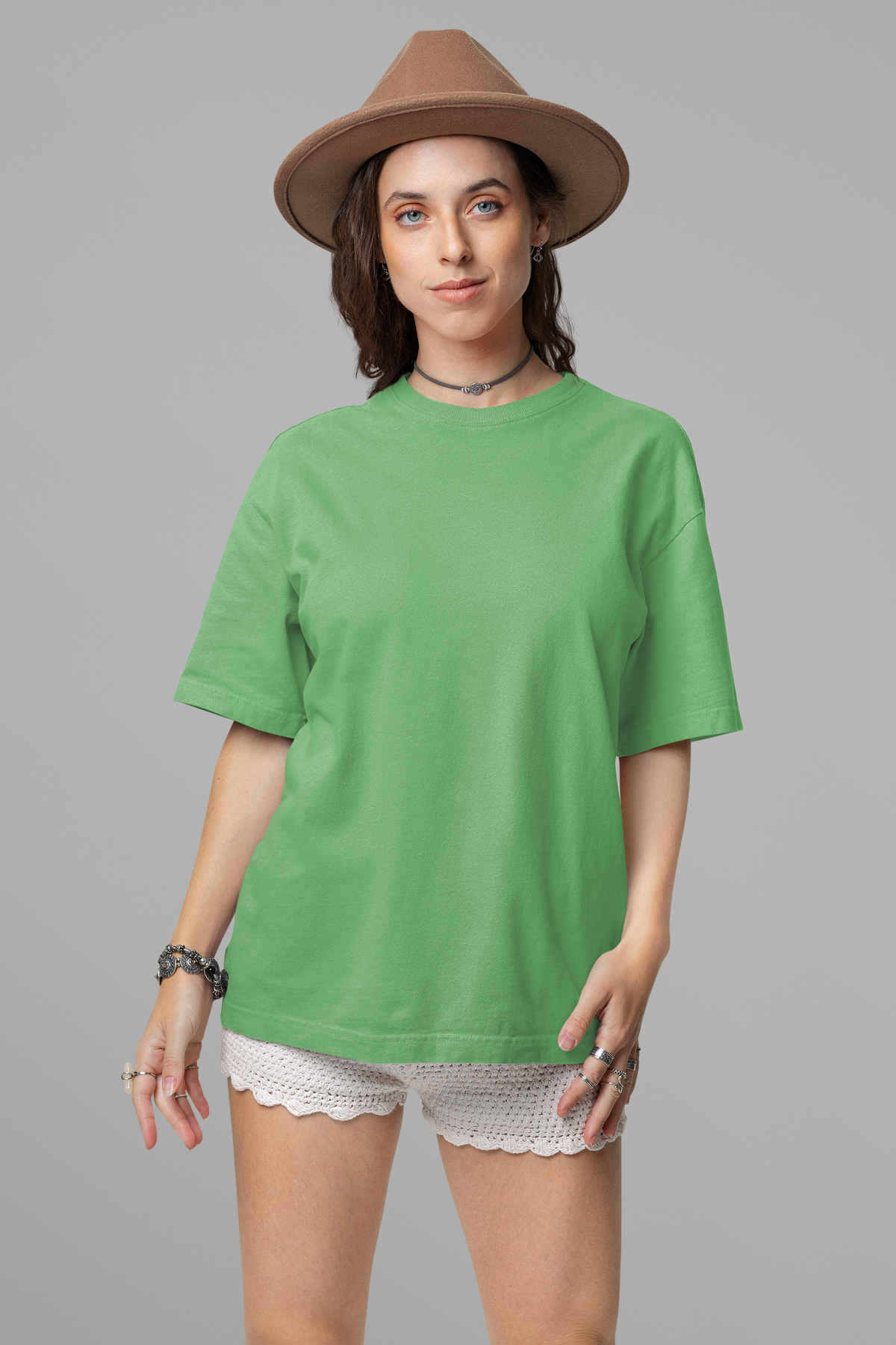 Sea Green oversized T-shirt with drop shoulder design, graphic print, and made from 100% cotton. Perfect for casual wear.
