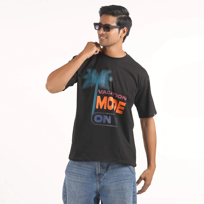 Vacation Mode On : Cotton oversized T-shirt in black featuring 'Vacation Mode On' print, drop shoulder design, round collar.