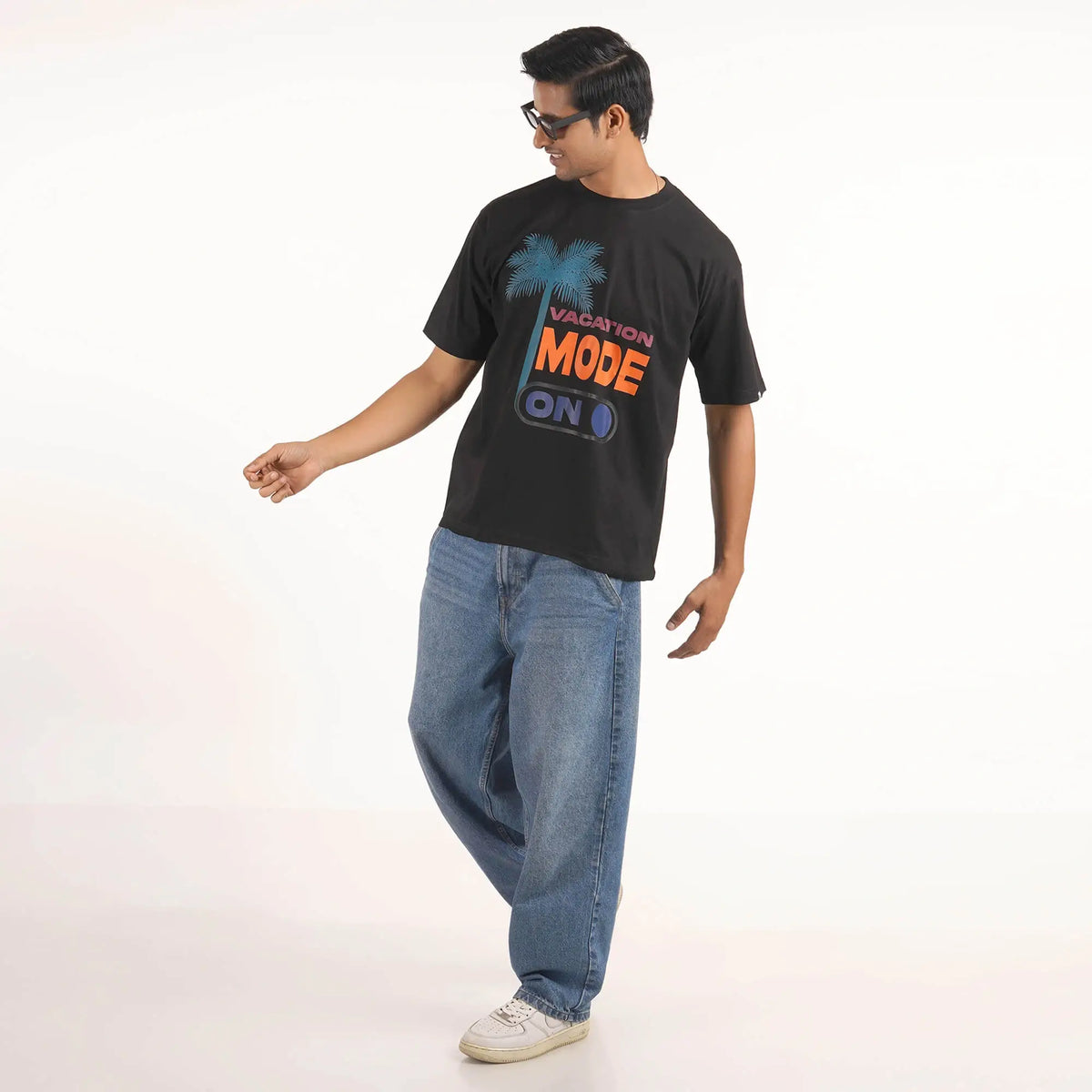 Vacation Mode On : stylish black oversized T-shirt with 'Vacation Mode On' graphic, drop shoulders, round collar.