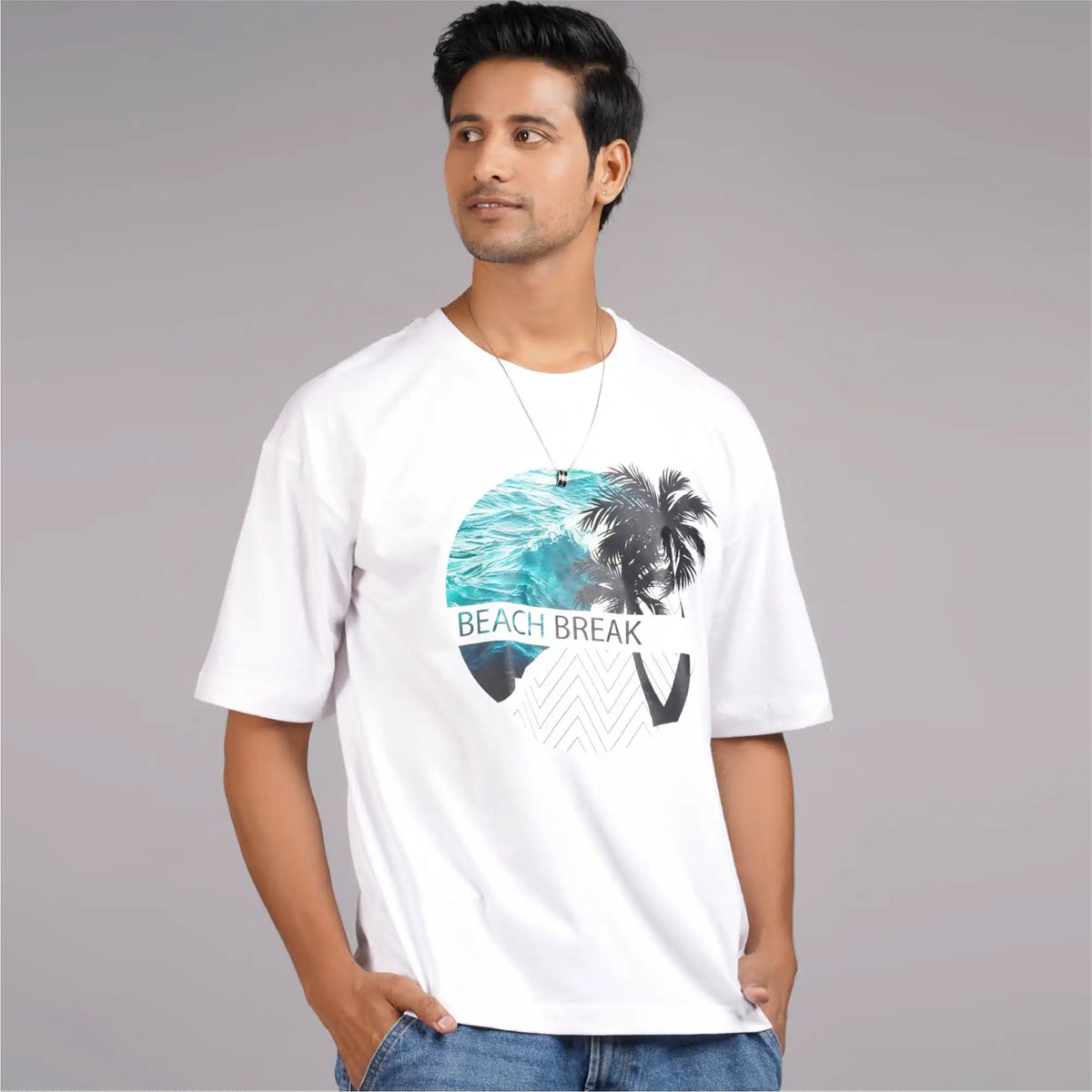 Beach Break graphic print men’s white t-shirt, featuring drop shoulders and a round collar. Available online.